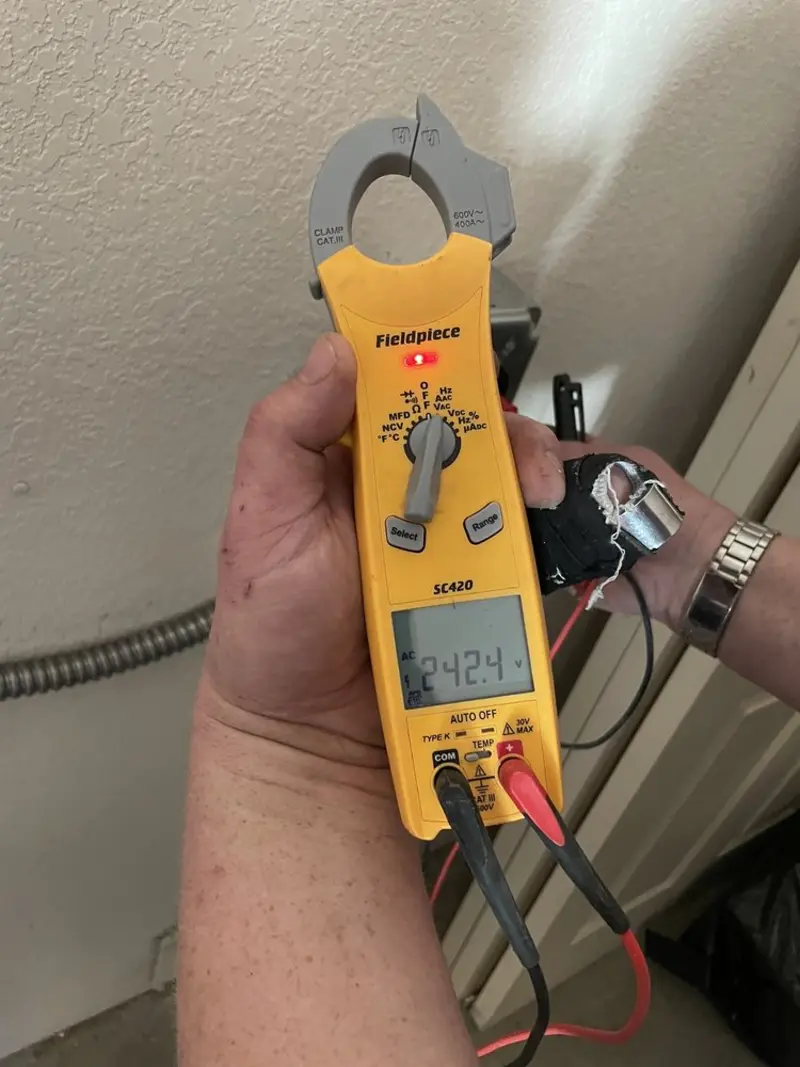 Voltage testing with clamp meter during Circuit Breaker Repair in Fulshear